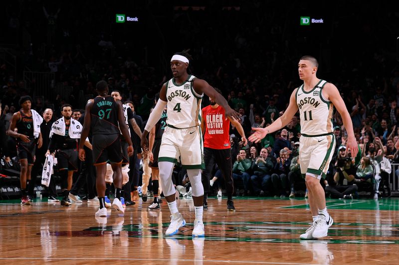 BOSTON, MA - FEBRUARY 9: Jrue Holiday #4 and Payton Pritchard #11 of the Boston Celtics celebrate during the game against the Washington Wizards on February 9, 2024 at the TD Garden in Boston, Massachusetts. NOTE TO USER: User expressly acknowledges and agrees that, by downloading and or using this photograph, User is consenting to the terms and conditions of the Getty Images License Agreement. Mandatory Copyright Notice: Copyright 2024 NBAE  (Photo by Brian Babineau/NBAE via Getty Images)