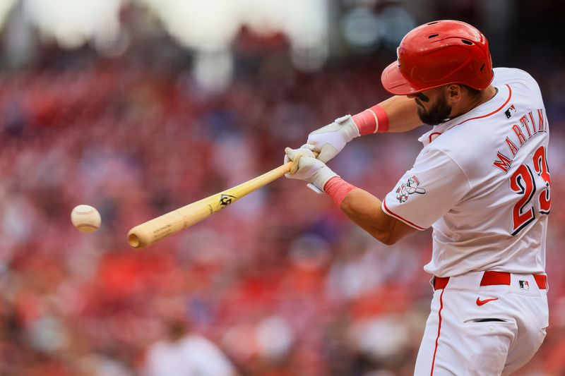 May 29, 2024; Cincinnati, Ohio, USA; Cincinnati Reds designated hitter Nick Martini (23) hits a single against the St. Louis Cardinals in the ninth inning at Great American Ball Park. Mandatory Credit: Katie Stratman-USA TODAY Sports