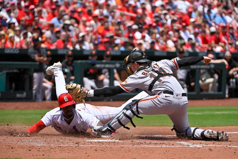 Jun 14, 2023; St. Louis, Missouri, USA;  St. Louis Cardinals left fielder Jordan Walker (18) is tagged out at home by San Francisco Giants catcher Patrick Bailey (14) during the third inning at Busch Stadium. Mandatory Credit: Jeff Curry-USA TODAY Sports