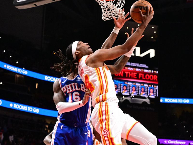 ATLANTA, GA - MARCH 10: Terance Mann #14 of the Atlanta Hawks drives to the basket during the game against the Philadelphia 76ers on March 10, 2025 at State Farm Arena in Atlanta, Georgia.  NOTE TO USER: User expressly acknowledges and agrees that, by downloading and/or using this Photograph, user is consenting to the terms and conditions of the Getty Images License Agreement. Mandatory Copyright Notice: Copyright 2025 NBAE(Photo by Adam Hagy/NBAE via Getty Images)