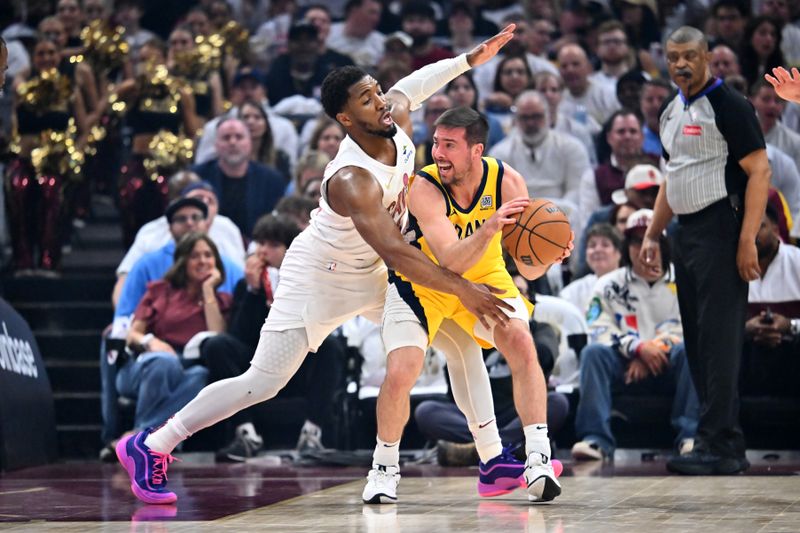 CLEVELAND, OHIO - MAY 06: Donovan Mitchell #45 of the Cleveland Cavaliers guards T.J. McConnell #9 of the Indiana Pacers during the first quarter of game two of the Eastern Conference Semifinals at Rocket Arena on May 06, 2025 in Cleveland, Ohio. NOTE TO USER: User expressly acknowledges and agrees that, by downloading and or using this photograph, User is consenting to the terms and conditions of the Getty Images License Agreement. (Photo by Jason Miller/Getty Images)