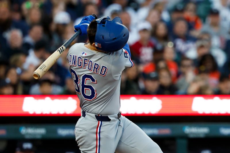 May 9, 2025; Detroit, Michigan, USA;  Texas Rangers left fielder Wyatt Langford (36) looses hos helmet as he strikes out in the sixth inning against the Detroit Tigers at Comerica Park. Mandatory Credit: Rick Osentoski-Imagn Images