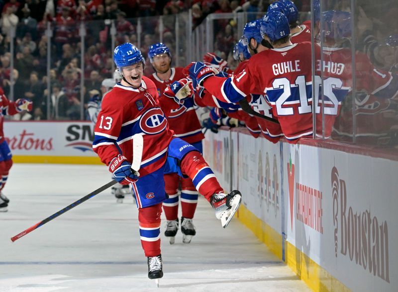 Oct 9, 2024; Montreal, Quebec, CAN; Montreal Canadiens forward Cole Caufield (13) celebrates with teammates after scoring a goal against the Toronto Maple Leafs during the first period at the Bell Centre. Mandatory Credit: Eric Bolte-Imagn Images