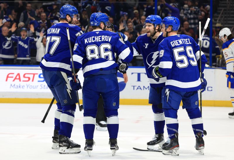Feb 3, 2026; Tampa, Florida, USA; Tampa Bay Lightning right wing Nikita Kucherov (86) is congratulated by left wing Brandon Hagel (38), defenseman Victor Hedman (77) and center Jake Guentzel (59)  after he scored a goal against the Buffalo Sabres during the first period at Benchmark International Arena. Mandatory Credit: Kim Klement Neitzel-Imagn Images