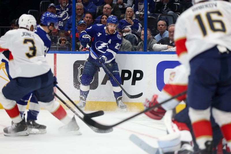 Apr 24, 2025; Tampa, Florida, USA; Tampa Bay Lightning defenseman Ryan McDonagh (27) passes the puck against the Florida Panthers during the first period in game two of the first round of the 2025 Stanley Cup Playoffs at Amalie Arena. Mandatory Credit: Nathan Ray Seebeck-Imagn Images