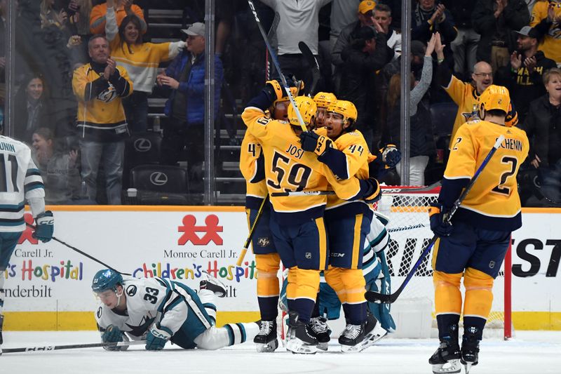 Mar 19, 2024; Nashville, Tennessee, USA; Nashville Predators right wing Michael McCarron (47) celebrates with teammates after a goal during the second period against the San Jose Sharks at Bridgestone Arena. Mandatory Credit: Christopher Hanewinckel-USA TODAY Sports