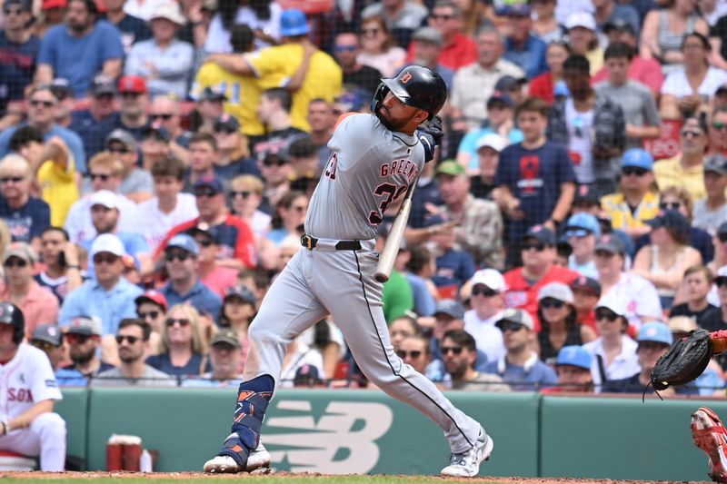 Jun 2, 2024; Boston, Massachusetts, USA;  Detroit Tigers center fielder Riley Greene (31) hits a single against the Boston Red Sox during the seventh inning at Fenway Park. Mandatory Credit: Eric Canha-USA TODAY Sports