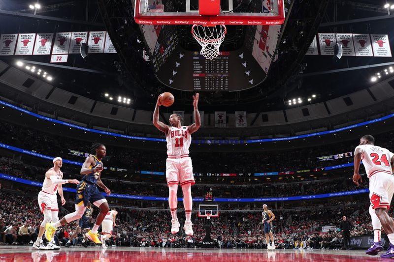 CHICAGO, IL - MARCH 27: DeMar DeRozan #11 of the Chicago Bulls grabs a rebound during the game against the Indiana Pacers on March 27, 2024 at United Center in Chicago, Illinois. NOTE TO USER: User expressly acknowledges and agrees that, by downloading and or using this photograph, User is consenting to the terms and conditions of the Getty Images License Agreement. Mandatory Copyright Notice: Copyright 2024 NBAE (Photo by Jeff Haynes/NBAE via Getty Images)