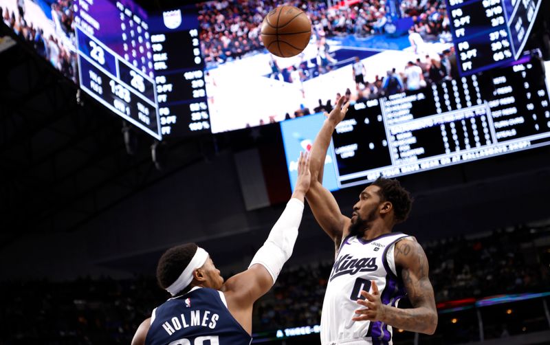 DALLAS, TX - JANUARY 27: Malik Monk #0 of the Sacramento Kings shoots over Richaun Holmes #20 of the Dallas Mavericks in the first half at American Airlines Center on January 27, 2024 in Dallas, Texas. NOTE TO USER: User expressly acknowledges and agrees that, by downloading and or using this photograph, User is consenting to the terms and conditions of the Getty Images License Agreement. (Photo by Ron Jenkins/Getty Images)