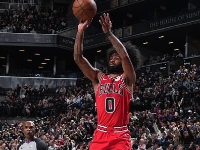 BROOKLYN, NY - NOVEMBER 26: Coby White #0 of the Chicago Bulls shoots a three point basket against the Brooklyn Nets on November 26, 2023 at Barclays Center in Brooklyn, New York. NOTE TO USER: User expressly acknowledges and agrees that, by downloading and or using this Photograph, user is consenting to the terms and conditions of the Getty Images License Agreement. Mandatory Copyright Notice: Copyright 2023 NBAE (Photo by Jesse D. Garrabrant/NBAE via Getty Images)