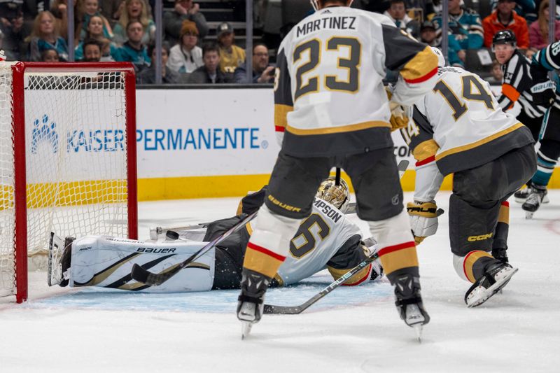 Feb 19, 2024; San Jose, California, USA; Vegas Golden Knights goaltender Logan Thompson (36) makes a save and the puck skirts out between the legs during the second period against the San Jose Sharks at SAP Center at San Jose. Mandatory Credit: Neville E. Guard-USA TODAY Sports