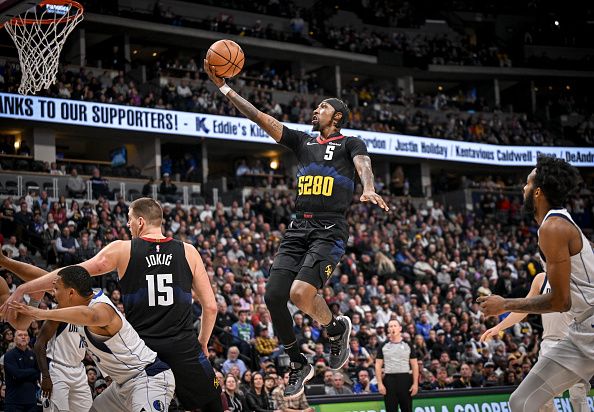 DENVER, CO - DECEMBER 18: Kentavious Caldwell-Pope (5) of the Denver Nuggets drives against the Dallas Mavericks during the first quarter at Ball Arena in Denver on Monday, December 18, 2023. (Photo by AAron Ontiveroz/The Denver Post)