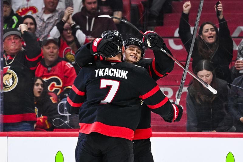 Nov 25, 2024; Ottawa, Ontario, CAN; Ottawa Senators left wing Brady Tkachuk (7) celebrates his goal against the Calgary Flames with Ottawa Senators center Tim Stutzle (18) during the third period at Canadian Tire Centre. Mandatory Credit: David Kirouac-Imagn Images