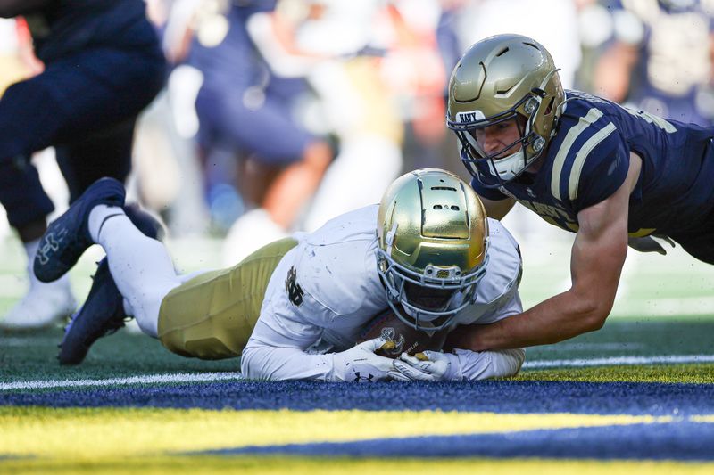 Oct 26, 2024; East Rutherford, New Jersey, USA; Notre Dame Fighting Irish linebacker Jaylen Sneed (3) recovers a fumble by Navy Midshipmen quarterback Blake Horvath (11) in the end zone for a defensive touchdown during the second half at MetLife Stadium. Mandatory Credit: Vincent Carchietta-Imagn Images