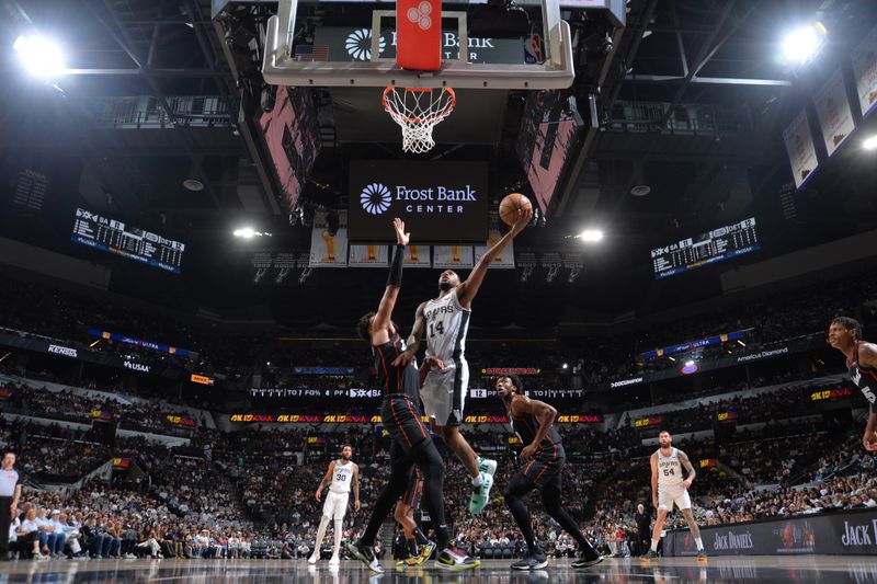 SAN ANTONIO, TX - APRIL 14: Blake Wesley #14 of the San Antonio Spurs drives to the basket during the game  against the Detroit Pistons on April 14, 2024 at the Frost Bank Center in San Antonio, Texas. NOTE TO USER: User expressly acknowledges and agrees that, by downloading and or using this photograph, user is consenting to the terms and conditions of the Getty Images License Agreement. Mandatory Copyright Notice: Copyright 2024 NBAE (Photos by Michael Gonzales/NBAE via Getty Images)