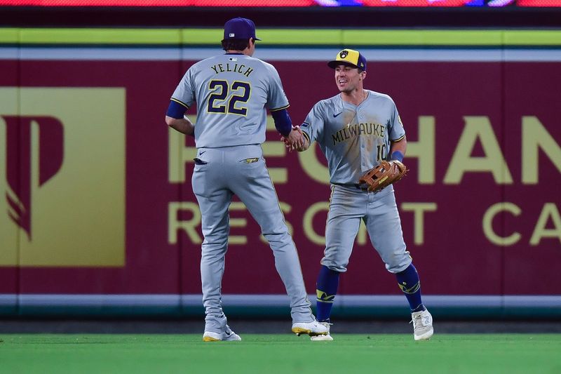 Jun 18, 2024; Anaheim, California, USA; Milwaukee Brewers outfielder Sal Frelick (10) celebrates with outfielder Christian Yelich (22) after catching the fly ball of Los Angeles Angels outfielder Taylor Ward (3) for the last out of the game at Angel Stadium. Mandatory Credit: Gary A. Vasquez-USA TODAY Sports