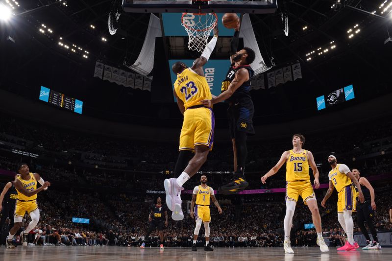 DENVER, CO - APRRIL 22: Jamal Murray #27 of the Denver Nuggets drives to the basket during the game against the Los Angeles Lakers during Round 1 Game 2 of the 2024 NBA Playoffs on April 22, 2024 at the Ball Arena in Denver, Colorado. NOTE TO USER: User expressly acknowledges and agrees that, by downloading and/or using this Photograph, user is consenting to the terms and conditions of the Getty Images License Agreement. Mandatory Copyright Notice: Copyright 2024 NBAE (Photo by Garrett Ellwood/NBAE via Getty Images)