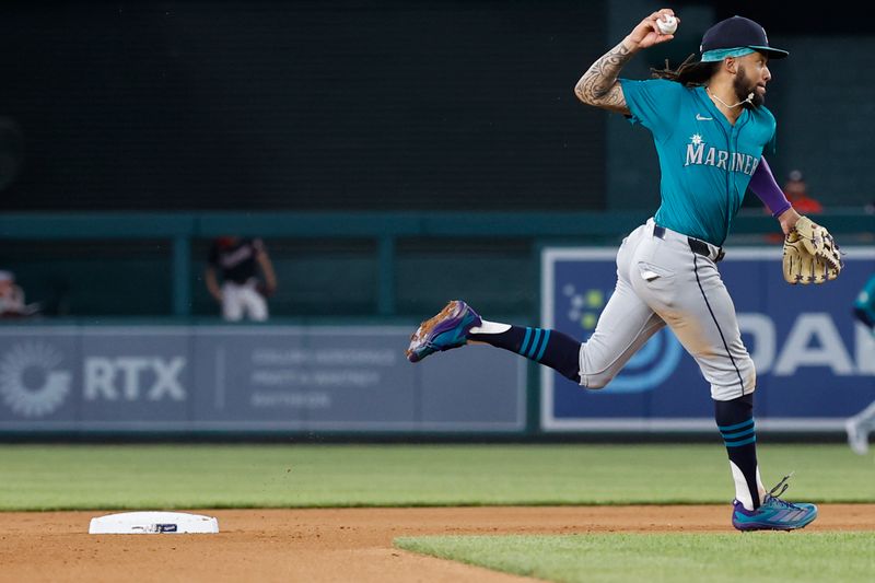May 24, 2024; Washington, District of Columbia, USA; Seattle Mariners shortstop J.P. Crawford (3) makes a play on a ground ball by Washington Nationals outfielder Jacob Young (not pictured) during the seventh inning at Nationals Park. Mandatory Credit: Geoff Burke-USA TODAY Sports