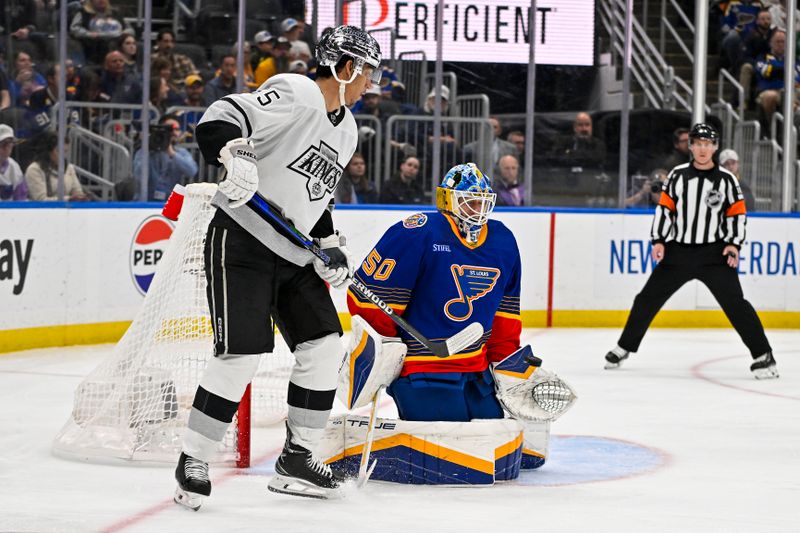 Mar 13, 2024; St. Louis, Missouri, USA;  St. Louis Blues goaltender Jordan Binnington (50) defends the net against Los Angeles Kings right wing Quinton Byfield (55) during the third period at Enterprise Center. Mandatory Credit: Jeff Curry-USA TODAY Sports