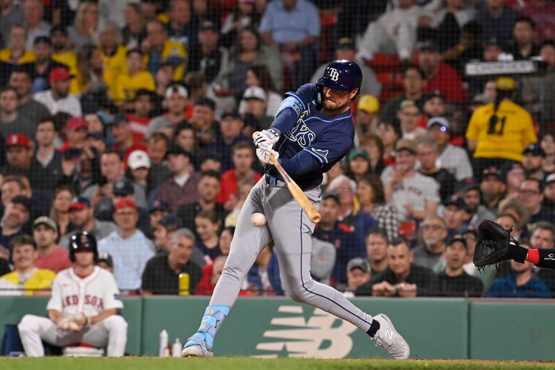 May 15, 2024; Boston, Massachusetts, USA; Tampa Bay Rays designated hitter Josh Lowe (15) hits a single against the Boston Red Sox during the fifth inning at Fenway Park. Mandatory Credit: Eric Canha-USA TODAY Sports