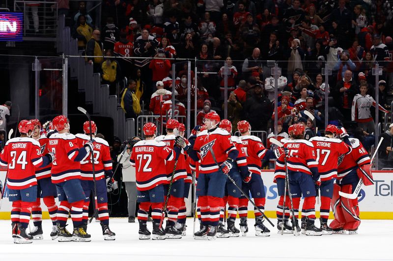 Nov 28, 2025; Washington, District of Columbia, USA; Washington Capitals players celebrate after their game against the Toronto Maple Leafs at Capital One Arena. Mandatory Credit: Geoff Burke-Imagn Images