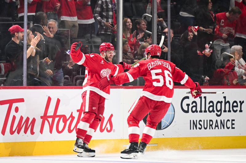 Oct 10, 2024; Detroit, Michigan, USA; Detroit Red Wings right wing Alex DeBrincat (93) celebrates his goal with defenseman Erik Gustafsson (56) during the first period against the Pittsburgh Penguins at Little Caesars Arena. Mandatory Credit: Tim Fuller-Imagn Images