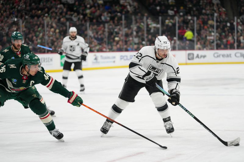 Feb 21, 2023; Saint Paul, Minnesota, USA; Los Angeles Kings left wing Kevin Fiala (22) is pressed by Minnesota Wild defenseman Jared Spurgeon (46) in the first period at Xcel Energy Center. Mandatory Credit: Matt Blewett-USA TODAY Sports