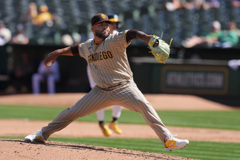 Sep 17, 2023; Oakland, California, USA; San Diego Padres relief pitcher Pedro Avila (60) throws a pitch against the Oakland Athletics during the fourth inning at Oakland-Alameda County Coliseum. Mandatory Credit: Darren Yamashita-USA TODAY Sports