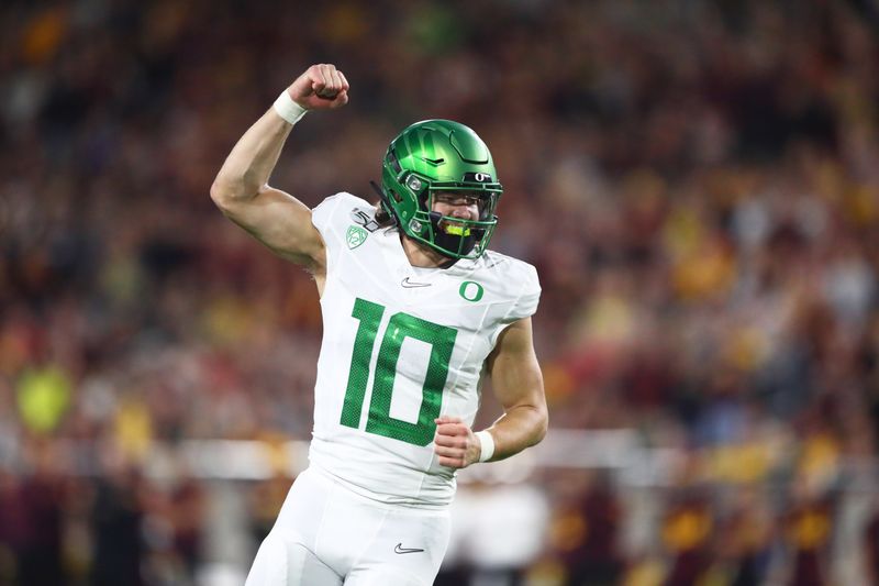 Nov 23, 2019; Tempe, AZ, USA; Oregon Ducks quarterback Justin Herbert (10) celebrates a touchdown against the Arizona State Sun Devils in the first half at Sun Devil Stadium. Mandatory Credit: Mark J. Rebilas-USA TODAY Sports