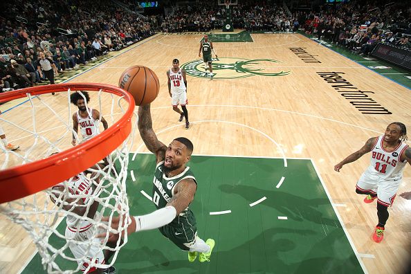 MILWAUKEE, WI - DECEMBER 11:  Damian Lillard #0 of the Milwaukee Bucks goes to the basket during the game on December 11, 2023 at the Fiserv Forum Center in Milwaukee, Wisconsin. NOTE TO USER: User expressly acknowledges and agrees that, by downloading and or using this Photograph, user is consenting to the terms and conditions of the Getty Images License Agreement. Mandatory Copyright Notice: Copyright 2023 NBAE (Photo by Gary Dineen/NBAE via Getty Images).