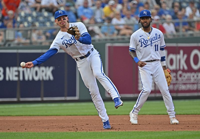 Jul 15, 2023; Kansas City, Missouri, USA;  Kansas City Royals shortstop Bobby Witt Jr. (7) throws the ball to first base for an out, as third baseman Maikel Garcia (11) looks on, in the third inning against the Tampa Bay Rays at Kauffman Stadium. Mandatory Credit: Peter Aiken-USA TODAY Sports