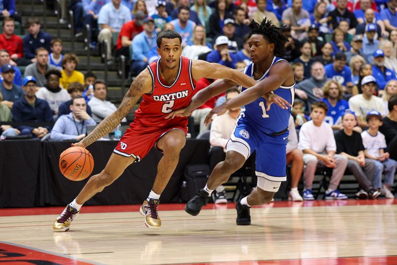 Nov 28, 2025; Kissimmee, FL, USA; Dayton Flyers guard De'Shayne Montgomery (2) drives to the basket past Brigham Young University Cougars guard Robert Wright III (1) in the first half during the ESPN Events Invitational at State Farm Field House. Mandatory Credit: Nathan Ray Seebeck-Imagn Images