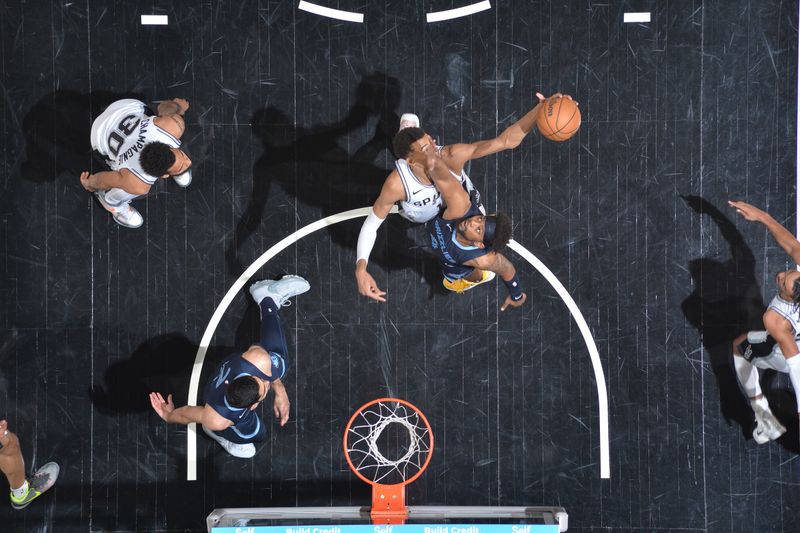 SAN ANTONIO, TX - MARCH 22  Victor Wembanyama #1 of the San Antonio Spurs grabs a rebound during the game against the Memphis Grizzlies on March 22, 2024 at the Frost Bank Center in San Antonio, Texas. NOTE TO USER: User expressly acknowledges and agrees that, by downloading and or using this photograph, user is consenting to the terms and conditions of the Getty Images License Agreement. Mandatory Copyright Notice: Copyright 2024 NBAE (Photos by Michael Gonzales/NBAE via Getty Images)