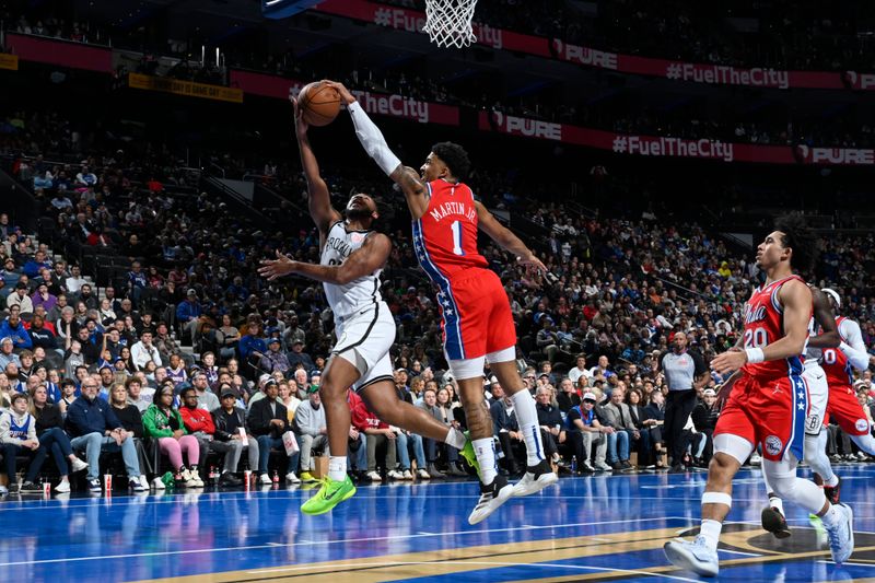 PHILADELPHIA, PA - NOVEMBER 22: KJ Martin #1 of the Philadelphia 76ers blocks the shot during the game against the Brooklyn Nets during the Emirates NBA Cup game on November 22, 2024 at the Wells Fargo Center in Philadelphia, Pennsylvania NOTE TO USER: User expressly acknowledges and agrees that, by downloading and/or using this Photograph, user is consenting to the terms and conditions of the Getty Images License Agreement. Mandatory Copyright Notice: Copyright 2024 NBAE (Photo by David Dow/NBAE via Getty Images)