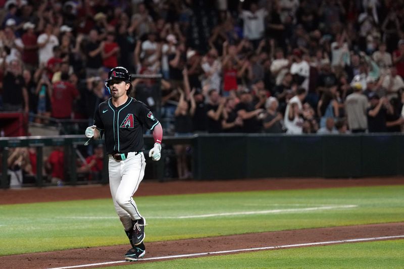 Aug 28, 2024; Phoenix, Arizona, USA; Arizona Diamondbacks outfielder Corbin Carroll (7) runs the bases after hitting a grand slam home run against the New York Mets during the eighth inning at Chase Field. Mandatory Credit: Joe Camporeale-USA TODAY Sports