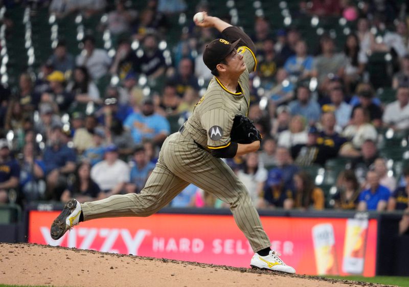 Jun 8, 2025; Milwaukee, Wisconsin, USA; San Diego Padres pitcher Yuki Matsui (1) delivers a pitch against the Milwaukee Brewers in the sixth inning at American Family Field. Mandatory Credit: Michael McLoone-Imagn Images