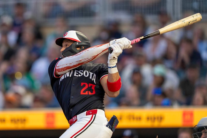 Jun 10, 2024; Minneapolis, Minnesota, USA; Minnesota Twins third baseman Royce Lewis (23) hits a two-run home run against the Colorado Rockies in the eighth inning at Target Field. Mandatory Credit: Jesse Johnson-USA TODAY Sports