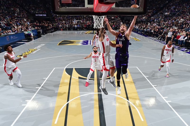 SACRAMENTO, CA - DECEMBER 3: Domantas Sabonis #11 of the Sacramento Kings drives to the basket during the game against the Houston Rockets during the Emirates NBA Cup game on December 3, 2024 at Golden 1 Center in Sacramento, California. NOTE TO USER: User expressly acknowledges and agrees that, by downloading and or using this Photograph, user is consenting to the terms and conditions of the Getty Images License Agreement. Mandatory Copyright Notice: Copyright 2024 NBAE (Photo by Adam Pantozzi/NBAE via Getty Images)