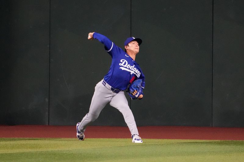 Sep 1, 2024; Phoenix, Arizona, USA;  Los Angeles Dodgers pitcher Yoshinobu Yamamoto (18) throws before the game against the Arizona Diamondbacks at Chase Field. Mandatory Credit: Joe Camporeale-USA TODAY Sports