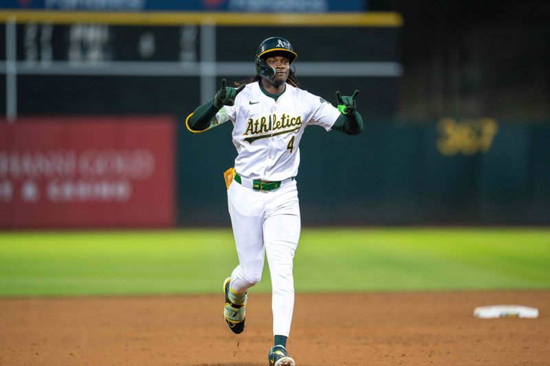 Aug 5, 2024; Oakland, California, USA;  Oakland Athletics outfielder Lawrence Butler (4) celebrates around the bases after the solo homer against the Chicago White Sox during the sixth inning at Oakland-Alameda County Coliseum. Mandatory Credit: Neville E. Guard-USA TODAY Sports