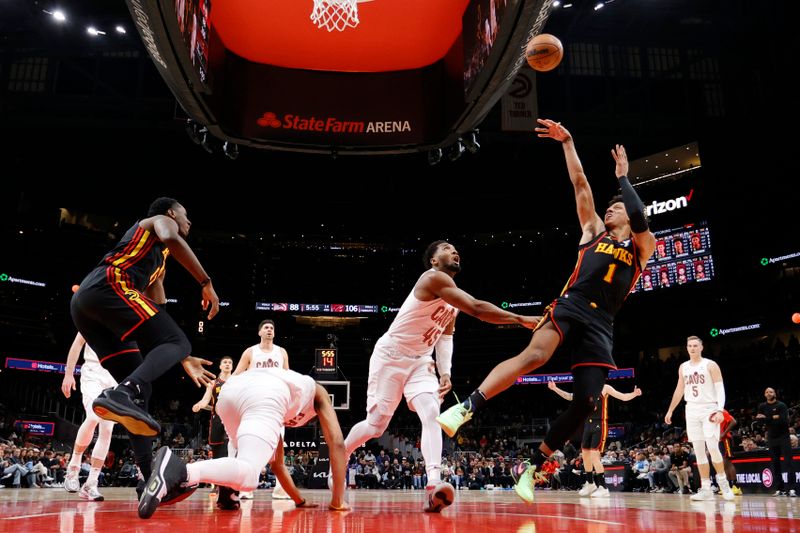 ATLANTA, GEORGIA - JANUARY 20: Jalen Johnson #1 of the Atlanta Hawks goes up against Donovan Mitchell #45 of the Cleveland Cavaliers during the second half at State Farm Arena on January 20, 2024 in Atlanta, Georgia. NOTE TO USER: User expressly acknowledges and agrees that, by downloading and or using this photograph, User is consenting to the terms and conditions of the Getty Images License Agreement. (Photo by Alex Slitz/Getty Images)