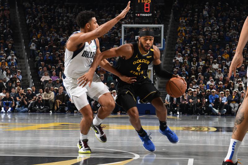 SAN FRANCISCO, CA - NOVEMBER 12: Moses Moody #4 of the Golden State Warriors drives to the basket during the game against the Dallas Mavericks during the Emirates NBA Cup game on November 12, 2024 at Chase Center in San Francisco, California. NOTE TO USER: User expressly acknowledges and agrees that, by downloading and or using this photograph, user is consenting to the terms and conditions of Getty Images License Agreement. Mandatory Copyright Notice: Copyright 2024 NBAE (Photo by Noah Graham/NBAE via Getty Images)