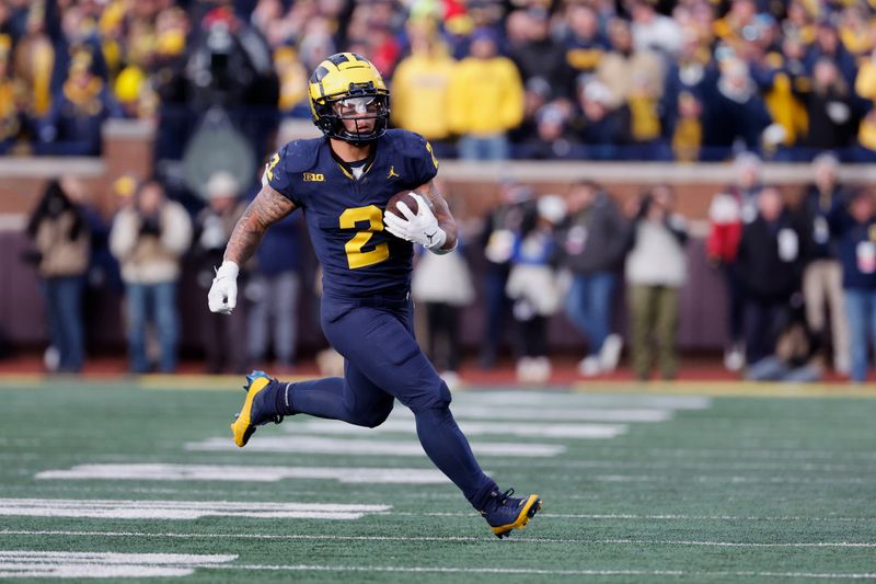 Nov 25, 2023; Ann Arbor, Michigan, USA; Michigan Wolverines running back Blake Corum (2) rushes in the second half against the Ohio State Buckeyes at Michigan Stadium. Mandatory Credit: Rick Osentoski-USA TODAY Sports