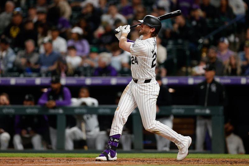 Apr 24, 2024; Denver, Colorado, USA; Colorado Rockies third baseman Ryan McMahon (24) hits a solo home run in the sixth inning against the San Diego Padres at Coors Field. Mandatory Credit: Isaiah J. Downing-USA TODAY Sports