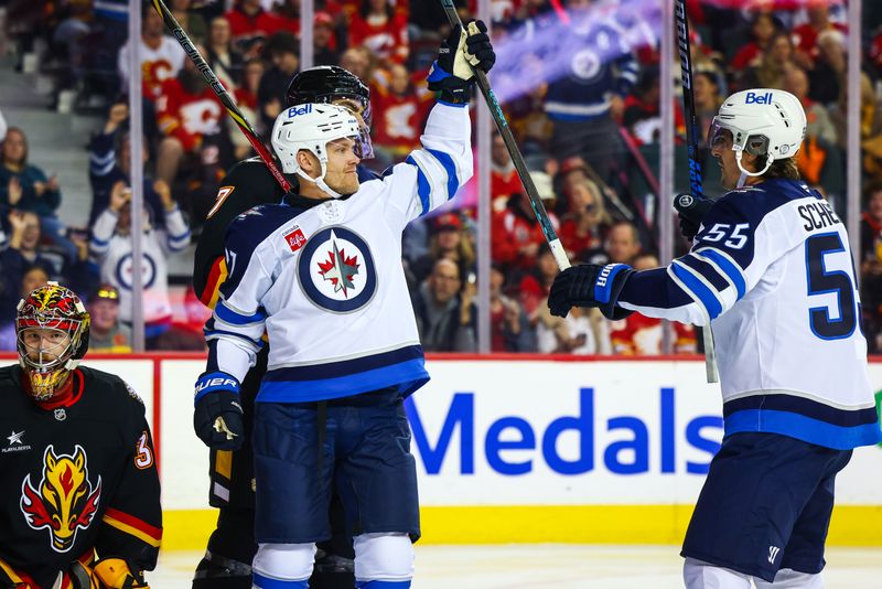 Oct 26, 2024; Calgary, Alberta, CAN; Winnipeg Jets left wing Nikolaj Ehlers (27) celebrates his goal against the Calgary Flames during the first period at Scotiabank Saddledome. Mandatory Credit: Sergei Belski-Imagn Images