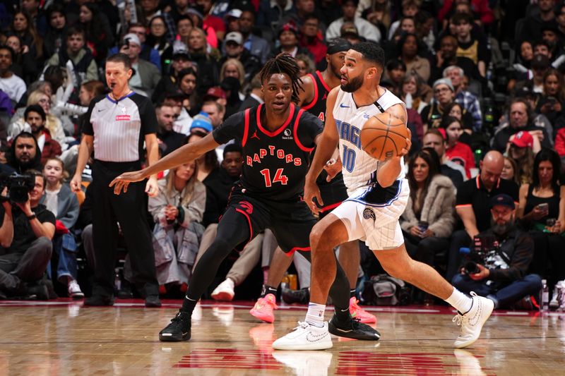 TORONTO, CANADA - JANUARY 3: Ja'Kobe Walter #14 of the Toronto Raptors plays defense during the game against the Orlando Magic on January 3, 2025 at the Scotiabank Arena in Toronto, Ontario, Canada.  NOTE TO USER: User expressly acknowledges and agrees that, by downloading and or using this Photograph, user is consenting to the terms and conditions of the Getty Images License Agreement.  Mandatory Copyright Notice: Copyright 2025 NBAE(Photo by Mark Blinch/NBAE via Getty Images)