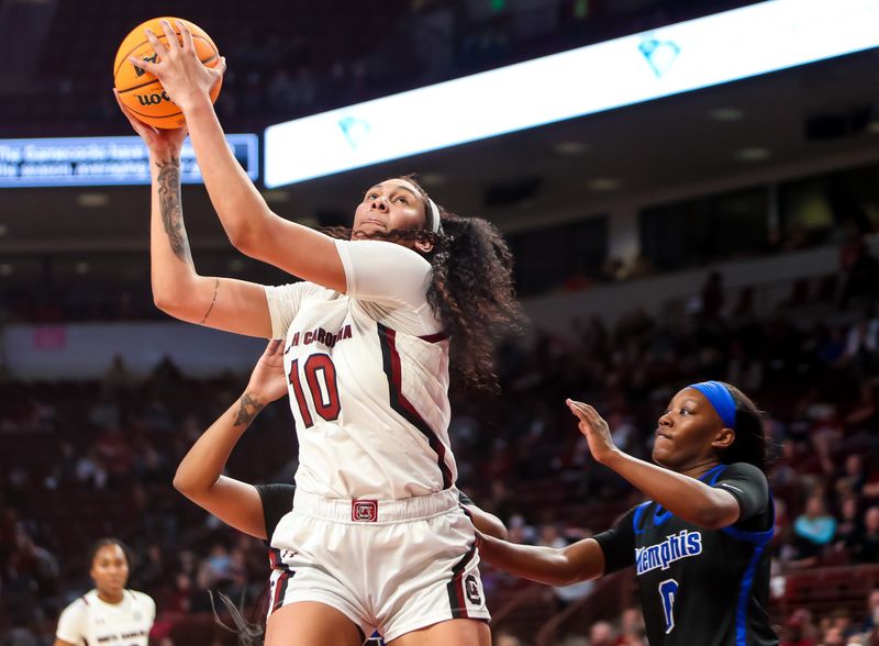 Dec 3, 2022; Columbia, South Carolina, USA; South Carolina Gamecocks center Kamilla Cardoso (10) grabs a rebound against the Memphis Tigers in the second half at Colonial Life Arena. Mandatory Credit: Jeff Blake-USA TODAY Sports