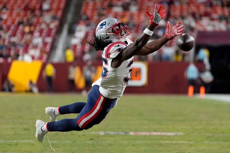 New England Patriots running back Deshaun Fenwick cannot catch a pass against the Washington Commanders during the second half of a preseason NFL football game, Sunday, Aug. 25, 2024, in Landover, Md. (AP Photo/George Walker IV)