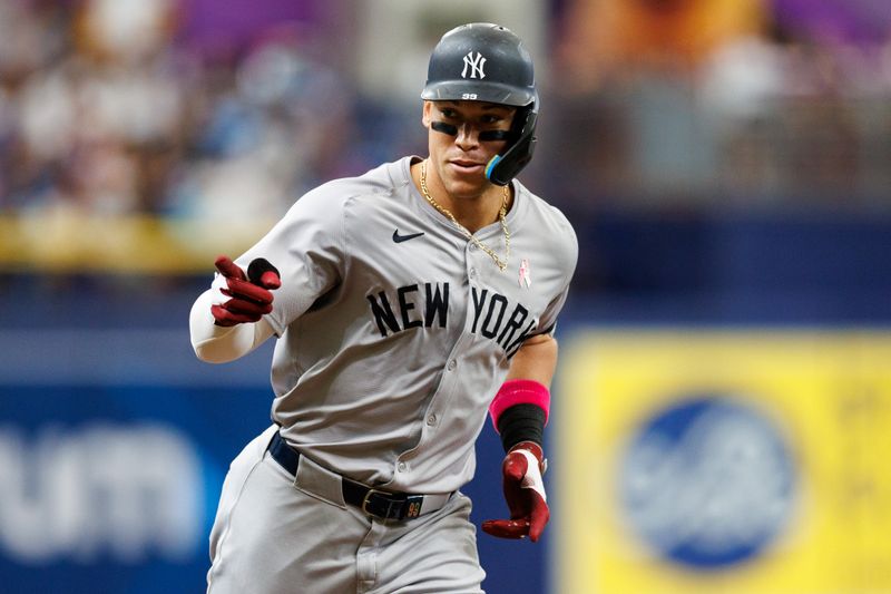 May 12, 2024; St. Petersburg, Florida, USA;  New York Yankees outfielder Aaron Judge (99) runs the bases after hitting a two run home run against the Tampa Bay Rays in the fifth inning at Tropicana Field. Mandatory Credit: Nathan Ray Seebeck-USA TODAY Sports