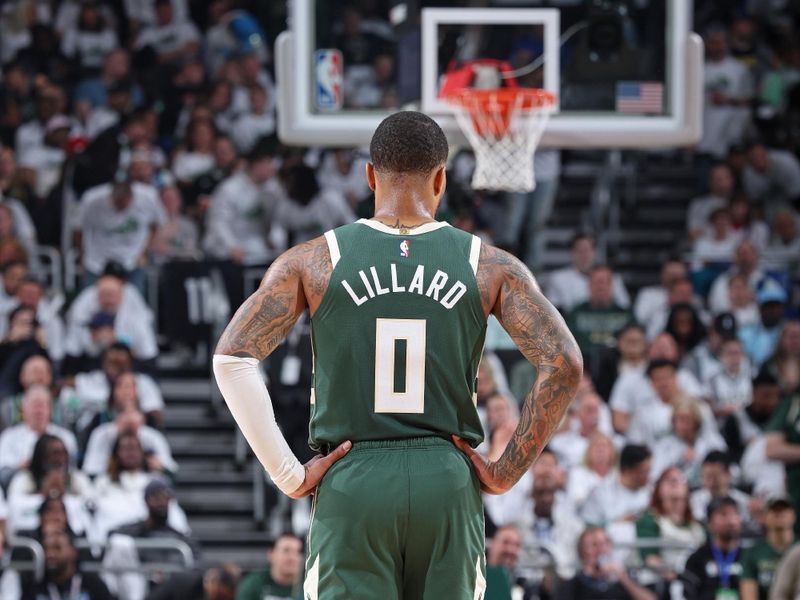 MILWAUKEE, WI - APRIL 23: Damian Lillard #0 of the Milwaukee Bucks looks on during Round 1 Game 2 of the 2024 NBA Playoffs against the Indiana Pacers on April 23, 2024 at the Fiserv Forum Center in Milwaukee, Wisconsin. NOTE TO USER: User expressly acknowledges and agrees that, by downloading and or using this Photograph, user is consenting to the terms and conditions of the Getty Images License Agreement. Mandatory Copyright Notice: Copyright 2024 NBAE (Photo by Jeff Haynes/NBAE via Getty Images).